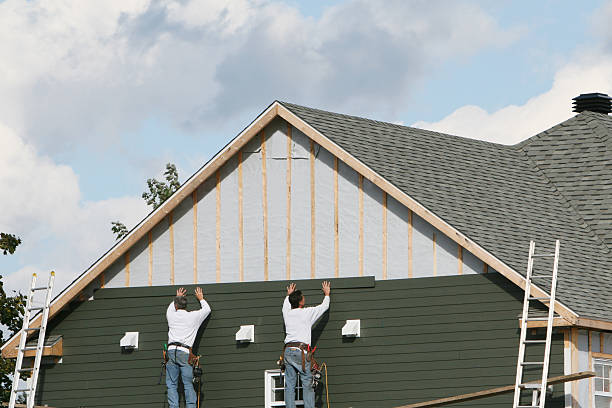 Professional Storm Damage Siding Repair technician working in Forest, OH